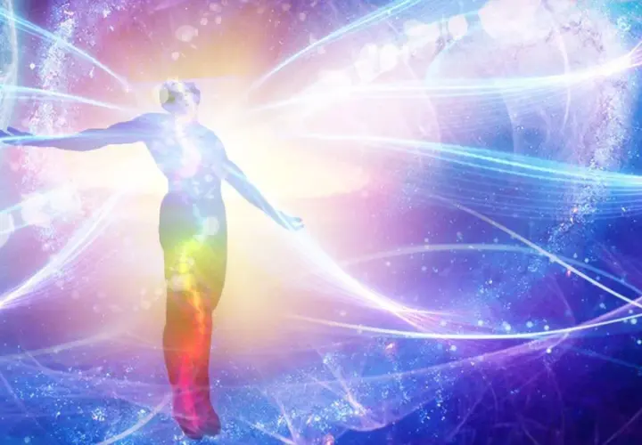 Silhouette of a person with arms outstretched, surrounded by colorful, swirling energy and cosmic elements.