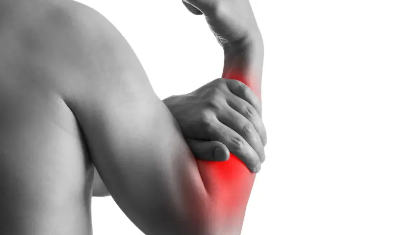 Person holding their right arm, with a red area highlighting pain or tension in the elbow and forearm.
