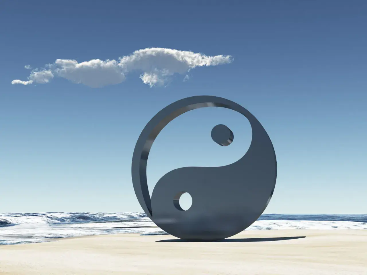 Simbolo Yin e Yang sulla spiaggia, con onde e cielo azzurro. Rappresenta l'equilibrio universale, il yin e yang significato esoterico.