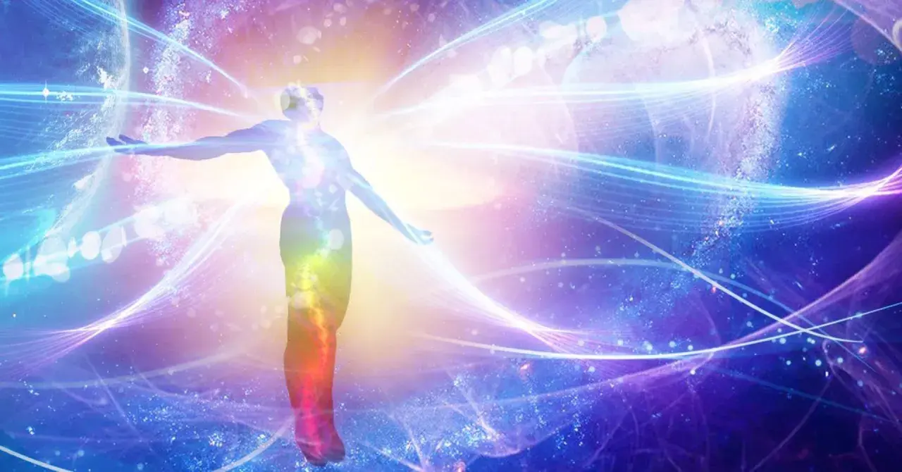 Silhouette of a person with arms outstretched, surrounded by colorful, swirling energy and cosmic elements.
